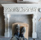 The white Carrara marble fireplace being ultimated, Frilli Gallery Marble Studio